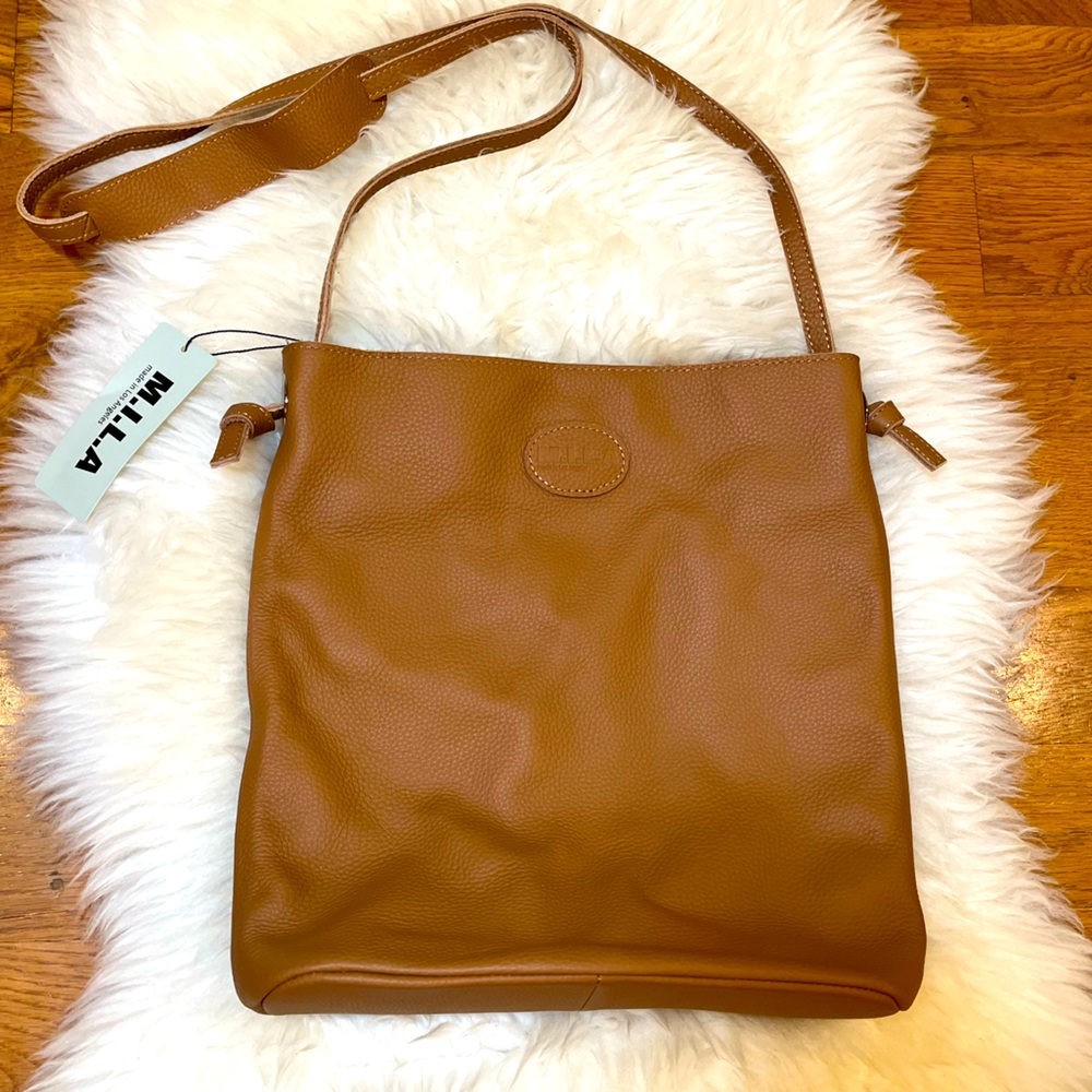 M.I.L.A.'s iconic Leather Caramel Colored Cross body Bag. NWT